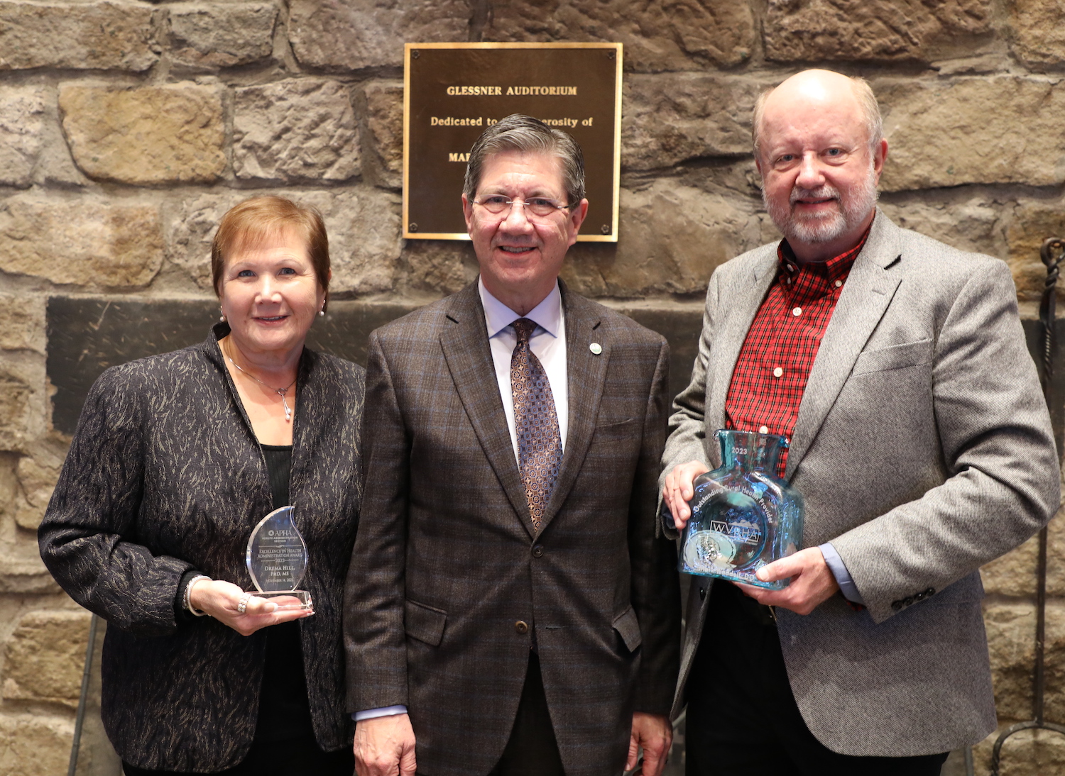 Three WVSOM representatives: Vice President Drema Hill, President James Nemitz, and Dr. Mark Waddell join for a photo in honor of Hill's and Waddell's awards. 