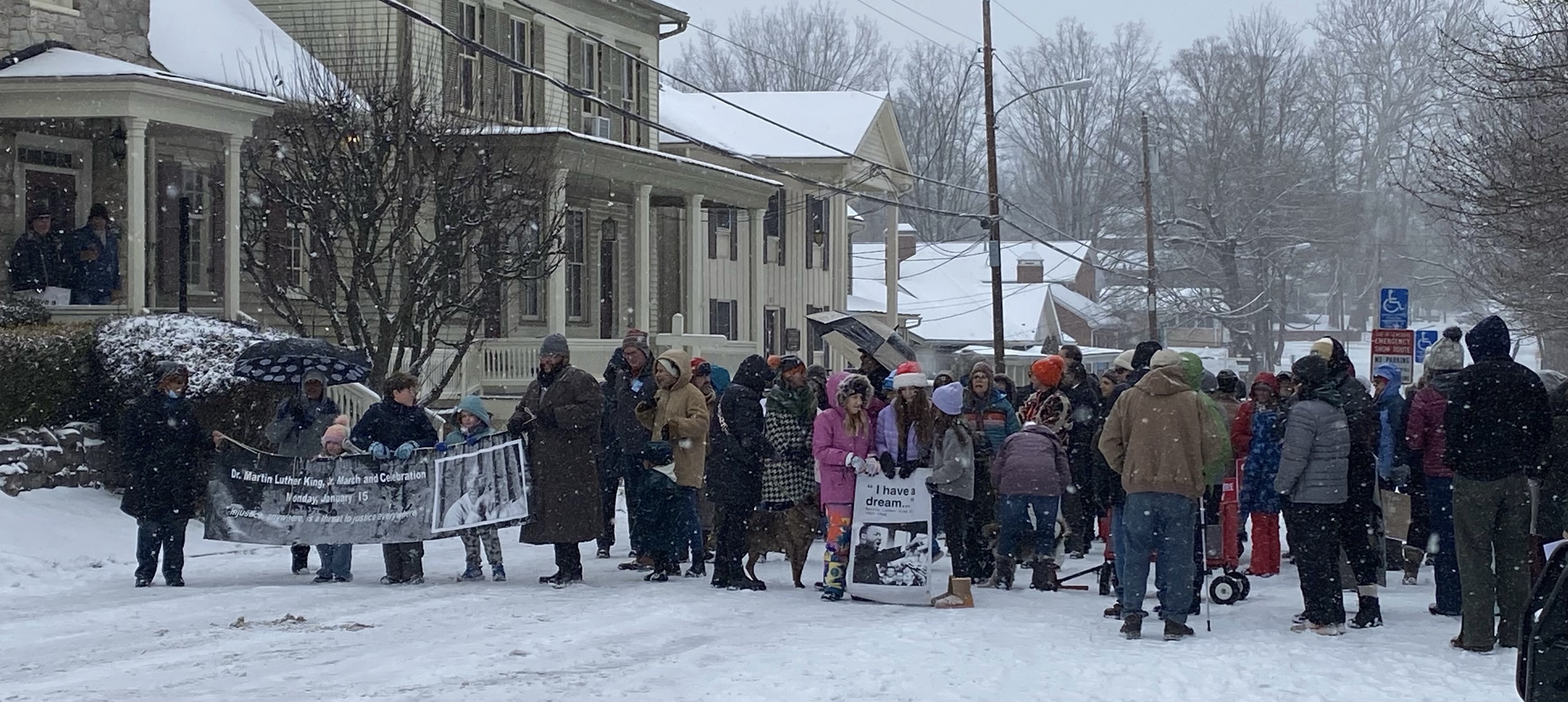 Large group of people march in Lewisburg during the MLK Day Parade. 