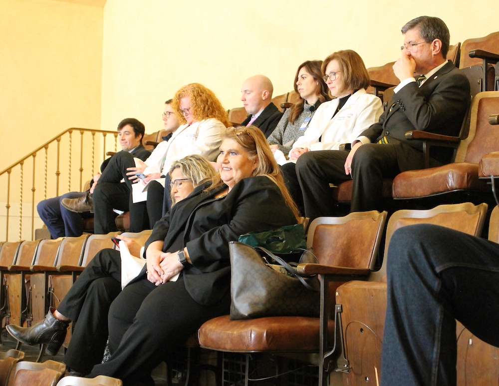 Group of people seated in rows