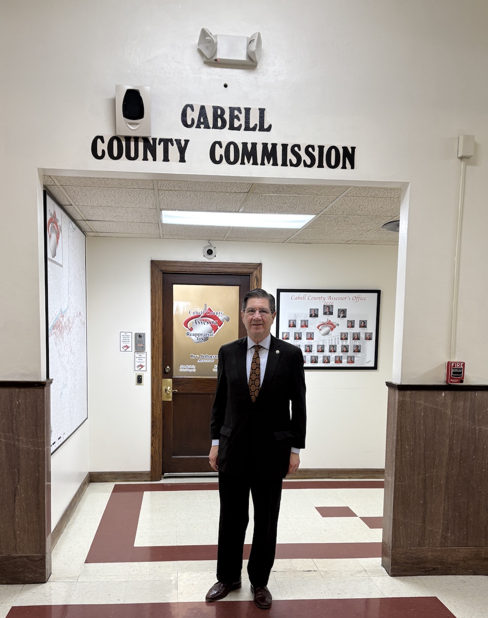 Man standing in hallway.