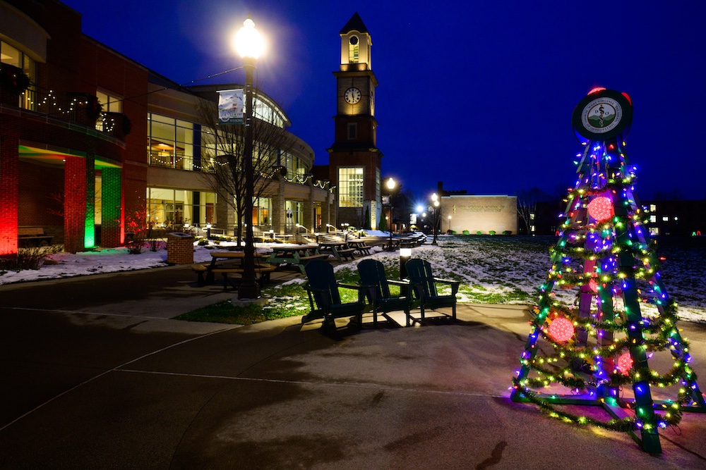 Christmas lights on a tree and buildings