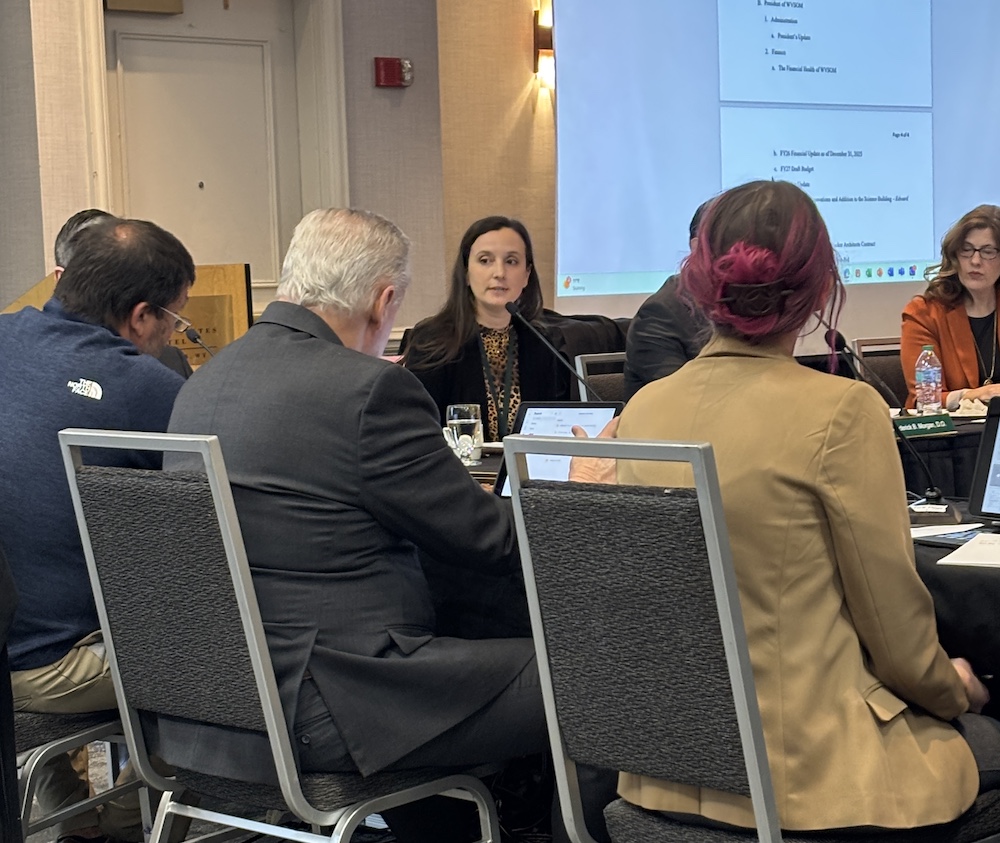 several people sit at a table