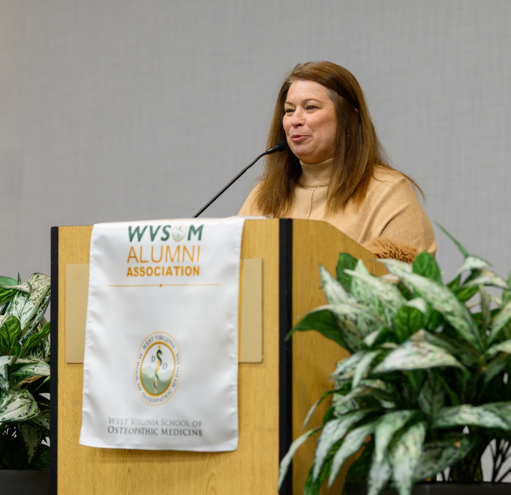 Woman speaks at podium