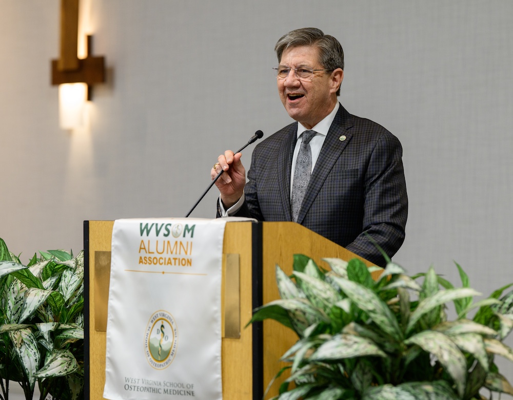 Man speaks at podium