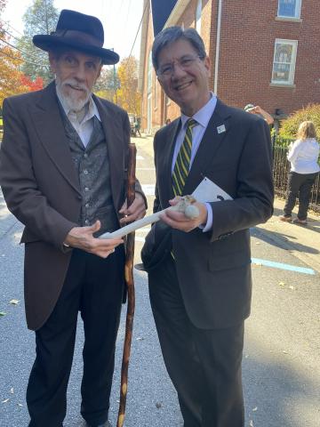 Dr. Nemitz and Dr. Foster hold a femur at parade