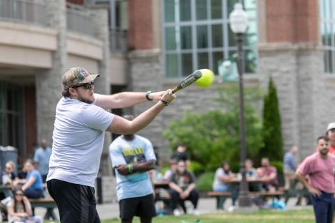 Man hitting a softball