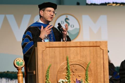 Man speaks at podium