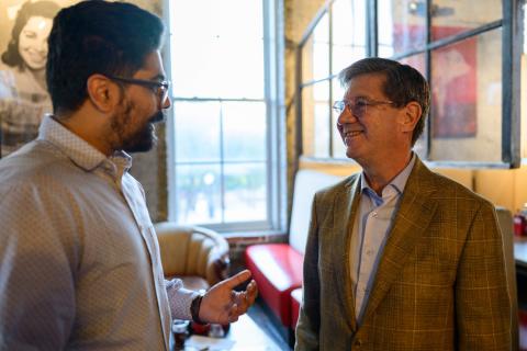 Two men talk