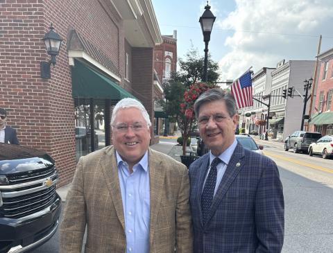 two men stand side by side
